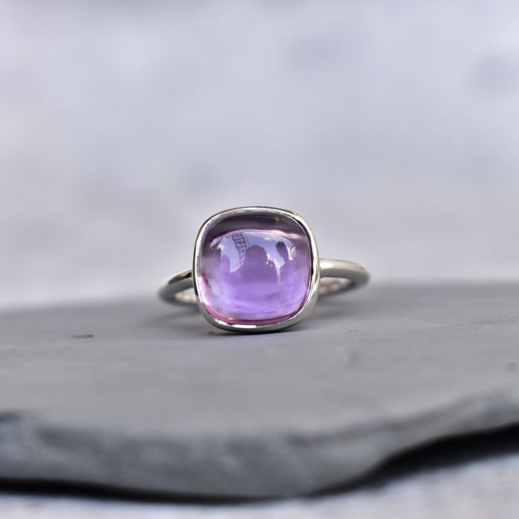 ✦ Gorgeous Natural Amethyst handmade sterling silver ring. A perfect Amethyst bohemian ring to become your statement jewelry or statement ring.  This purple quartz ring for women is also a great choice for engagement or alternative engagement ring And in case your want it to use as a proposal ring to make your first impression memorable your have all the good reason to go ahead with this. 💎  Please Note As with all Natural Gemstones The colors and inclusion patterns if applicable may vary sligh Luxury Silver Amethyst Ring With Natural Stones, Elegant Stackable Adjustable Amethyst Ring, Silver Stackable Amethyst Rings, Purple Hallmarked Amethyst Ring For Gift, Fine Jewelry Sterling Silver Solitaire Amethyst Ring, Amethyst Gemstone Stackable Rings For Wedding, Elegant Amethyst Stackable Rings As Gift, Purple Gemstone Stackable Rings In Sterling Silver, Elegant Sterling Silver Amethyst Ring With Bezel Setting