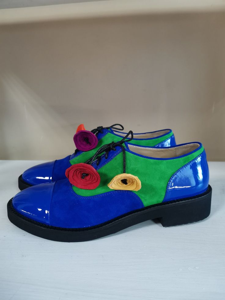 "Perfect your modern look for any occasion with these women's leather and suede oxford shoes. We use only high quality genuine leather to deliver the best result. PRODUCT INFORMATION * High quality leather, suede and patent leather upper (available in a variety of colors) * Blue patent leather / blue suede / green suede / multicolor flowers * Smooth and breathable leather lining * Lace-up design * Round toe * Lightly padded footbed footbed for all-day comfort * Man-made outsole * Heel: 2.5 cm / Formal Suede Oxfords, Formal Suede Oxfords For Spring, Spring Formal Suede Oxfords, Elegant Spring Suede Lace-up Shoes, Spring Party Lace-up Shoes With Leather Sole, Blue Oxfords With Brogue Detailing For Spring, Blue Round Toe Oxfords For Spring, Leather Shoes For Derby In Spring, Spring Blue Oxfords With Brogue Detailing