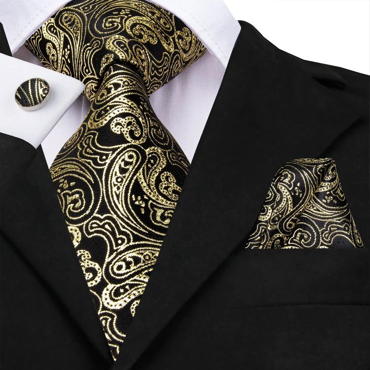 FEATURES Beautiful Eye-Catching Design High-Density Durable Fabric Perfect for Daily Dress, Business, Office, Meeting, Birthday, Wedding, Engagement, Ball Party and More Occasion. Comes in protective and simple packing, easy to wrap and ready to gift WHAT YOU GET Matching Necktie Matching Cufflinks Matching Pocket Square SPECIFICATIONS Material: 100% Jacquard Woven Silk Density of 1200 stitches Designer: Italian Necktie Size: 59.06''(150cm) in length and 3.35''(8.5cm) in width Handkerchief Size: Flower Tie, Mens Silk Ties, Cool Box, Grey Suit, Unique Ties, Men Store, Tie Design, Black Luxury, Cufflink Set