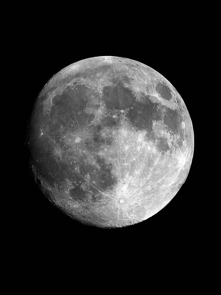 the full moon is shown in black and white