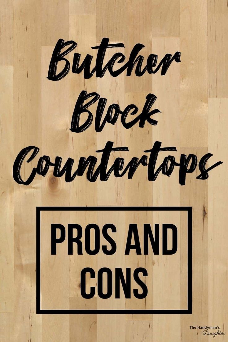 the butcher block countertops pros and cons sign on a wooden floor with black lettering