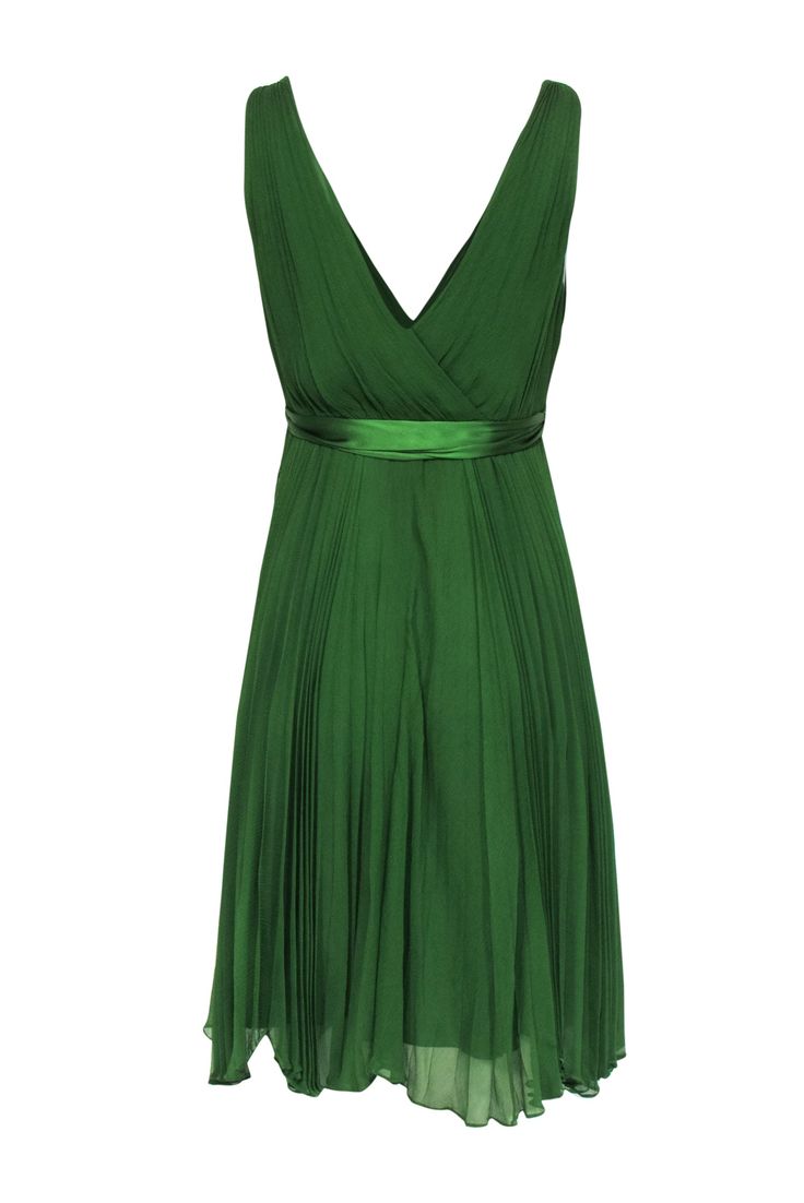 You will surely look as beautiful as a precious stone in this lovely emerald green mini dress from Rebecca Taylor. The pleated chiffon offers soft and floaty movement when you are wearing it. The soft fabric and movement will have you wearing this piece with elegance and delicacy. Pair with a matching emerald heel for any of your upcoming dressy events. Size 6 Shell & Lining: 100% Silk Concealed side zipper Fully lined A-line silhouette Surplice V-neckline Pleated detail Satin waist belt Bust 33 Elegant Chiffon A-line Pleated Dress, Chic Green Mini Dress For Prom, Flowy Chiffon Pleated Dress For Party, Chic Green A-line Chiffon Dress, Elegant A-line Chiffon Pleated Dress, Elegant Chiffon Pleated Cocktail Dress, Pleated Chiffon A-line Party Dress, Green Flowy A-line Chiffon Dress, Elegant Flowy Mini Dress For Prom