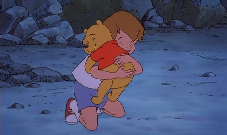 winnie the pooh hugging her teddy bear