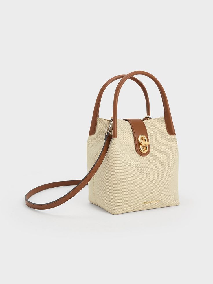 Tan Aubrielle Canvas Bucket Bag - CHARLES & KEITH US Beige Box Bag With Detachable Handle For On-the-go, Beige Box Bag With Detachable Handle, Cream Box Bag With Detachable Handle, Cream Box Bag For Everyday Use, Modern Cream Box Bag With Removable Pouch, Modern Cream Box Bag With Detachable Handle, Eco-friendly Everyday Bucket Bag With Top Handle, Eco-friendly Shopping Bucket Bag With Removable Pouch, Modern Beige Box Bag