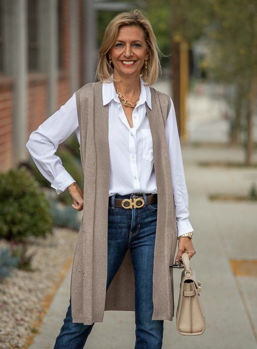 Here is our trendy Taupe Lightweight Open Front Cardigan Vest  Knitted in a soft lightweight taupe yarn Yarn content: 70% Viscose, 30% Nylon Color: Taupe Straight long body with two side slits Two pockets in the front Ribbing detail in the front, armholes and pocket  Center back length 34" Wardrobe For 60 Year Old, Ageless Style Over 70 Classy, Chic Taupe Cardigan For Fall, Versatile Beige Knit Cardigan, Beige Knit Cardigan For Work, Chic Taupe Cardigan For Spring, Chic Beige Cardigan For Layering, Chic Taupe Spring Cardigan, Chic Long Beige Cardigan