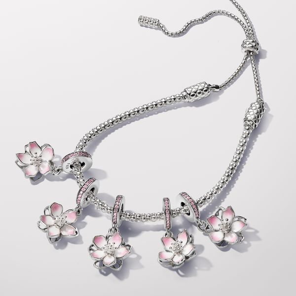 Celebrate the first signs of spring with our sterling silver Cherry Blossom Dangle Charm. Featuring hand-applied pink and white enamel and accented by sparkling pink cubic zirconia, the petals on our cherry blossom rotate slightly, as if they were being blown in the breeze. A pavé-covered bail is the finishing touch on this must-have floral charm. Style it with other cool-toned jewellery for a warm spring look. - Pandora Cherry Blossom Dangle Charm - Enamel / Sterling silver / Cubic Zirconia / P Cherry Blossom Bracelet, First Signs Of Spring, Pearl Diamond Jewelry, Blossom Bracelet, Disney Earrings, Signs Of Spring, Charms Pandora, Bracelet Pandora, Solid Gold Necklace