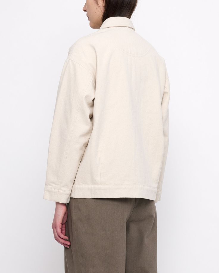 A shirt jacket with a utilitarian touch. Features a paneled construction, spread collar and button placket. The design is anchored by two oversized gusseted side pockets. Relaxed fit. A staple for transitioning seasons. + Details Color: Off-White 100% Cotton XS, S, M, L, XL Julie is 5’9” and wearing a XS Hand wash cold, lay flat to dry. Can be machine washed cold. Do not tumble dry. Can be dry cleaned. + Material A sturdy heavyweight cotton twill reminiscent of workwear canvas. Resilient and eas Beige Relaxed Fit Utility Jacket For Work, Unstructured Collared Utility Jacket With Buttoned Pockets, Oversized Utility Jacket With Lapel Collar For Everyday, Oversized Classic Utility Jacket With Patch Pockets, Everyday Utility Jacket With Lapel Collar And Patch Pockets, White Shacket With Lapel Collar And Pockets, White Shacket With Pockets For Work, Oversized Lapel Collar Shacket With Patch Pockets, White Collared Utility Jacket With Pockets