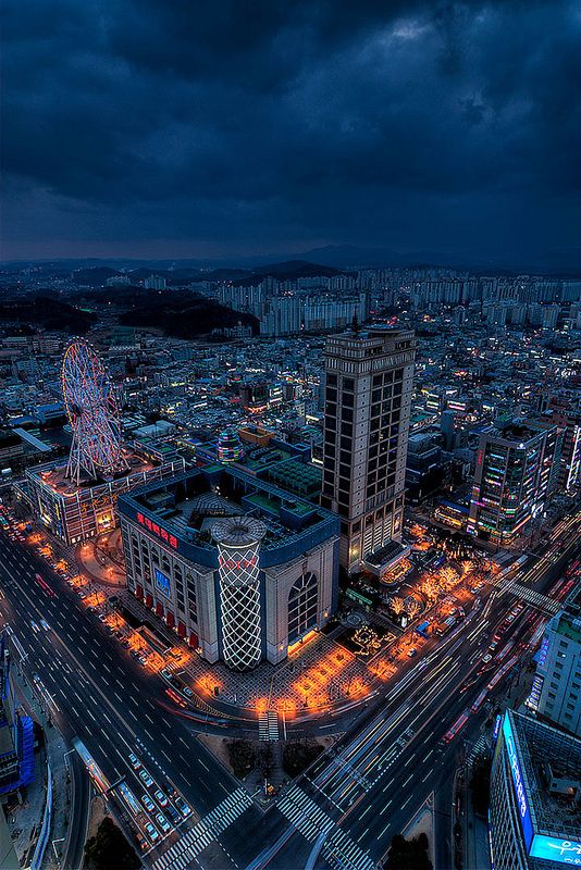 an aerial view of a city at night