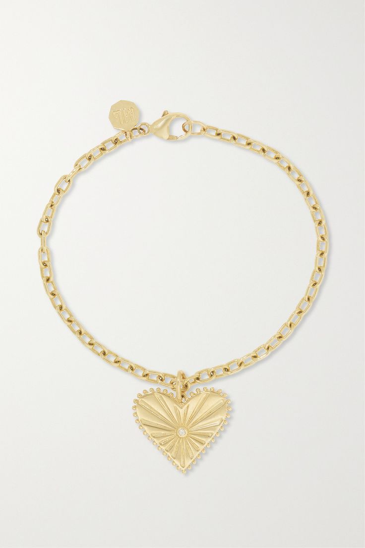 The perfect way to mark an anniversary or special occasion, Marlo Laz's 'Small Pour Toujours' bracelet is engraved with a French expression that translates to 'Forever and Always'. It's crafted from 14-karat gold and suspends a heart-shaped pendant that's intricately etched and encrusted with a single diamond. The slender chain links make it a practical addition to your everyday rotation. Luxury White Gold Bracelet With Heart Charm, Luxury Wedding Heart Bracelet With Heart Charm, Luxury Diamond Heart Bracelet, Luxury Heart Charm Bracelet For Anniversary, Diamond Engraved Bracelet Gift, Engraved Diamond Bracelet As Gift, Engraved Diamond Bracelet For Gift, Luxury Engraved Diamond Bracelet For Wedding, Luxury 14k Gold Bracelet For Anniversary