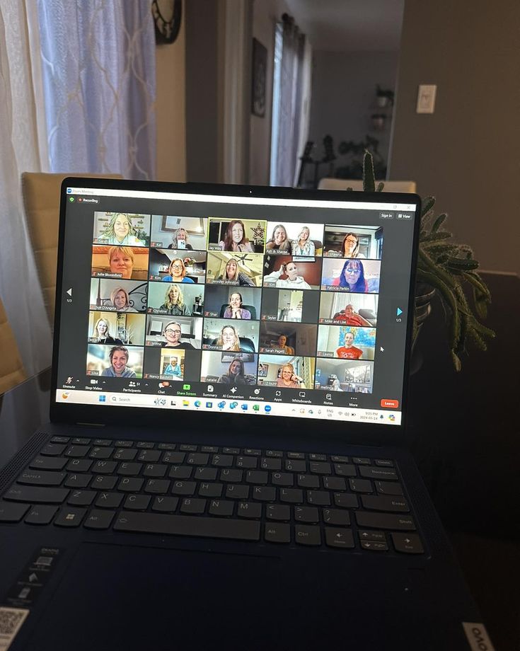 an open laptop computer sitting on top of a table