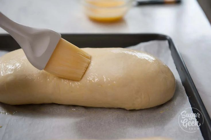 a loaf of bread being made with a spatula