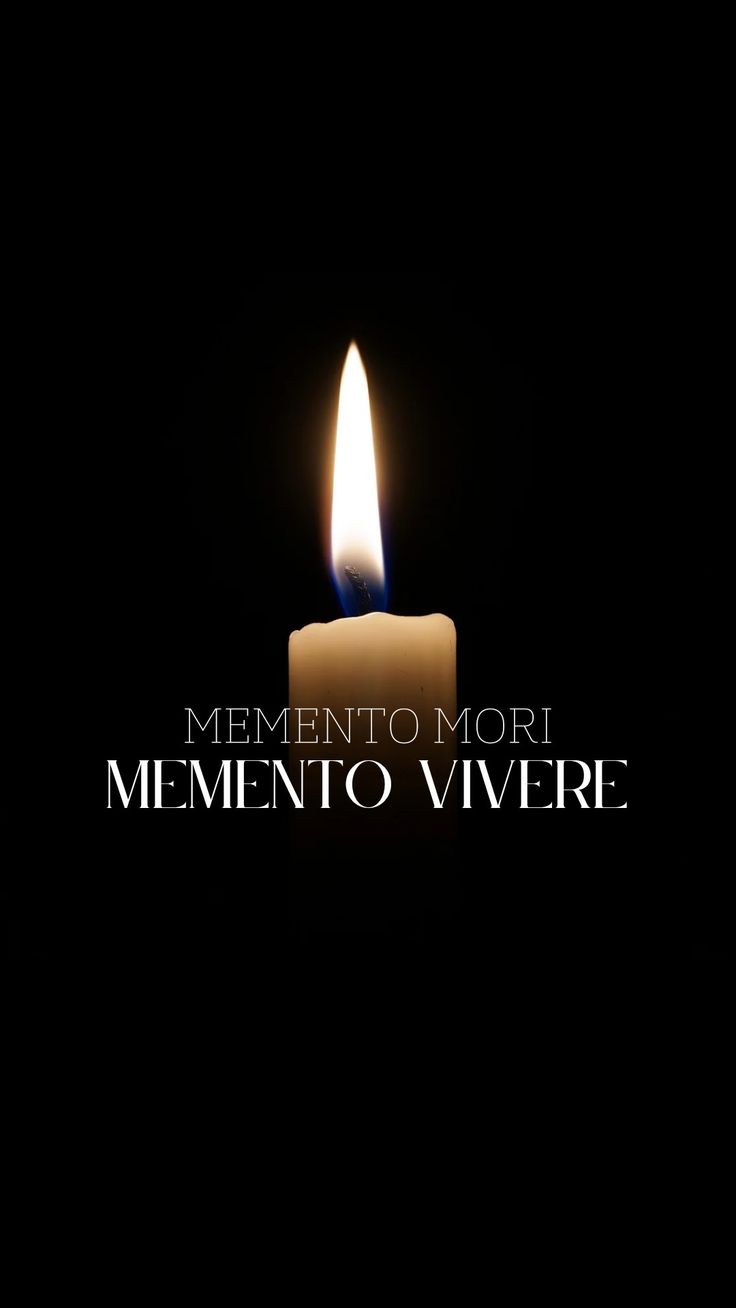 a lit candle with the words'mementoo mori mi - mino vivre '