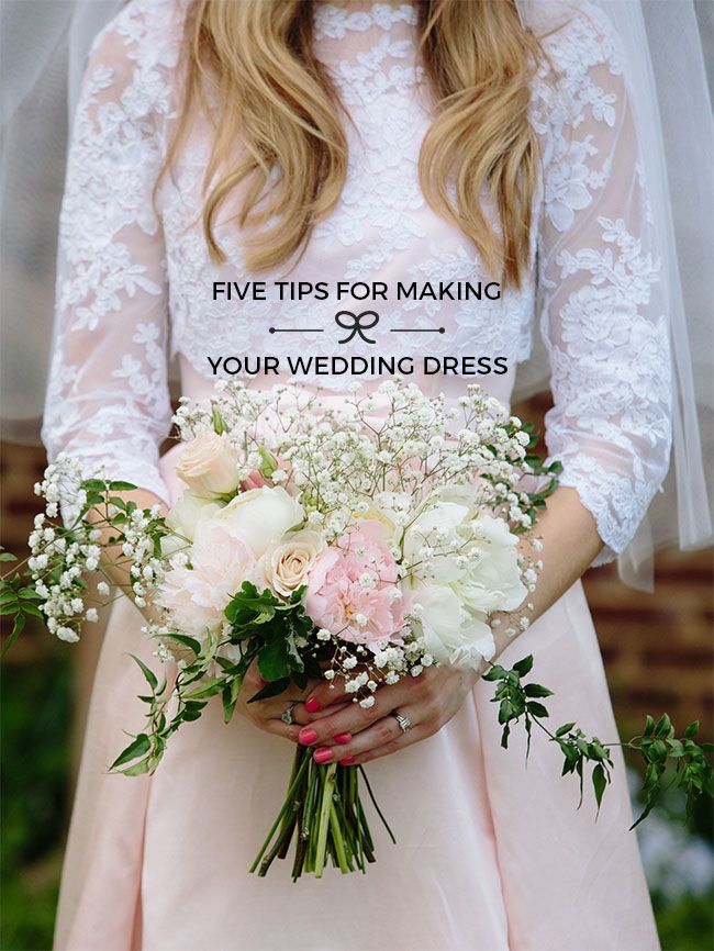 a woman in a wedding dress holding a bouquet