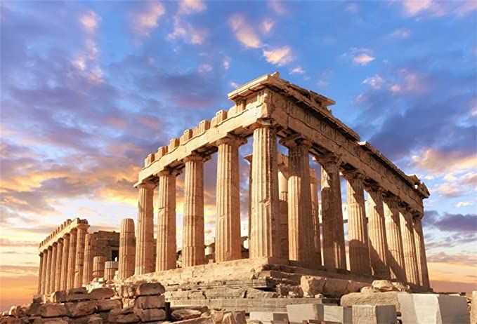 the ruins of an ancient greek temple at sunset