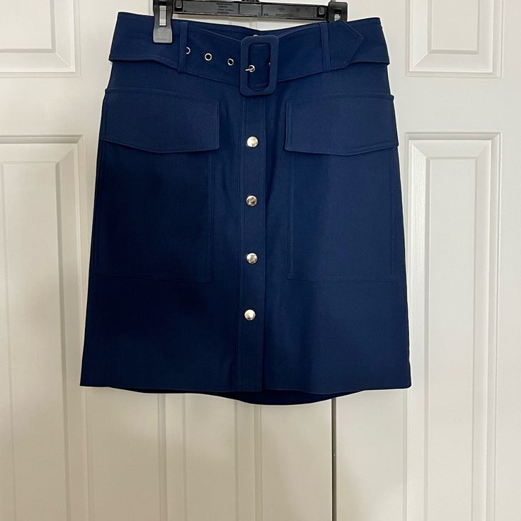 Brand New Women’s Size Small Button Front Skirt With 2 Pockets. Belt Is Removable. 19-Inch Length Smoke Free/Pet Free Home Utility Skirt With Pockets For Work, Button-up Workwear Bottoms With Pockets, Fall Workwear Skirt With Buttoned Pockets, Blue Button-up Bottoms For Work, Blue Button-up Bottoms With Pockets, Workwear Mini Skirt With Snap Buttons, Navy Work Skirt With Pockets, Utility Bottoms With Buttoned Pockets For Work, Navy Workwear Skirt With Pockets