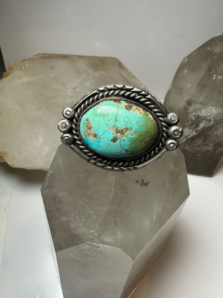 Turquoise  ring size 7.50 adj southwest sterling silver women  I leave the rings unpolished until I sell .. If the buyer wants the ring polished I will then polish the ring as some people like the patina....   Size 7.50 adj Weight 23.2g Length.  1. 1/8"    Width.  1 1/2" Back on the band  3/16" Free Shipping & Free Postal Insurance  Delivered in a Gift Box  Free First Class shipping and postal insurance is included. If you want to upgrade to priority kindly pay an additional fee to do so.  This Artisan Untreated Open Ring Jewelry, Southwestern Silver Open Ring Jewelry, Southwestern Style Silver Open Ring Jewelry, Adjustable Sterling Silver Turquoise Spiritual Ring, Adjustable Sterling Silver Spiritual Turquoise Ring, Southwestern Turquoise Ring In Sterling Silver, Southwestern Silver Turquoise Open Ring, Southwestern Style Silver Turquoise Open Ring, Southwestern Style Silver Open Turquoise Ring