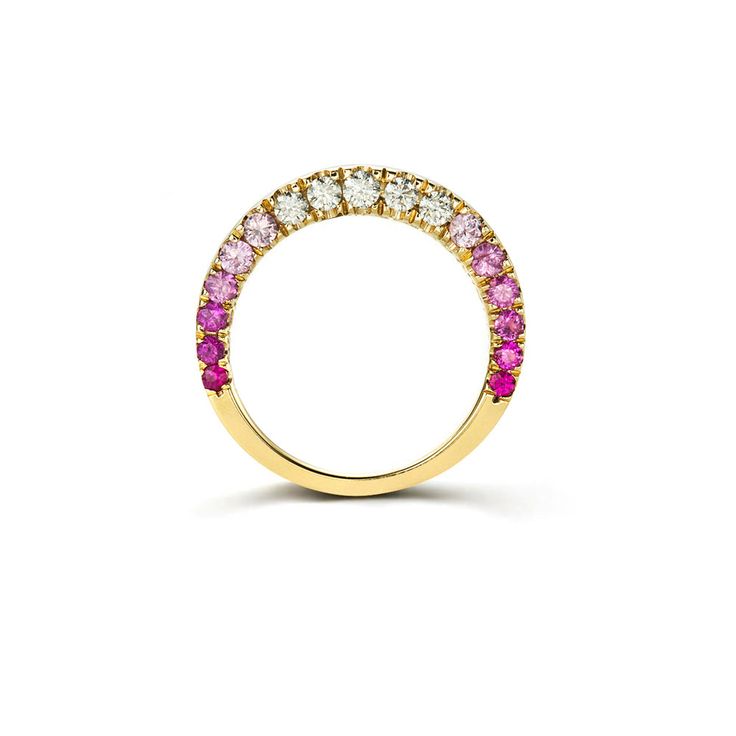 a yellow gold ring with pink and white stones