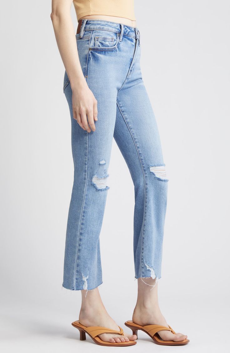 Rock a vintage-meets-modern vibe in high-rise, raw-cropped flare jeans made from stretchy denim that's ripped and faded. 26" inseam; 10 1/2" front rise Zip fly with button closure Five-pocket style 93% cotton, 5% polyester, 2% spandex Machine wash, tumble dry Imported Trendy Fitted Distressed Flares, Chic Mid-rise Distressed Flare Jeans, Ripped Fitted Flare Jeans, Chic Ripped Stretch Flare Jeans, Chic Stretch Ripped Flare Jeans, Chic Distressed Mid-rise Flare Jeans, Chic Ripped High Rise Flare Jeans, Chic High Rise Ripped Flare Jeans, Chic Fitted Ripped Flare Jeans