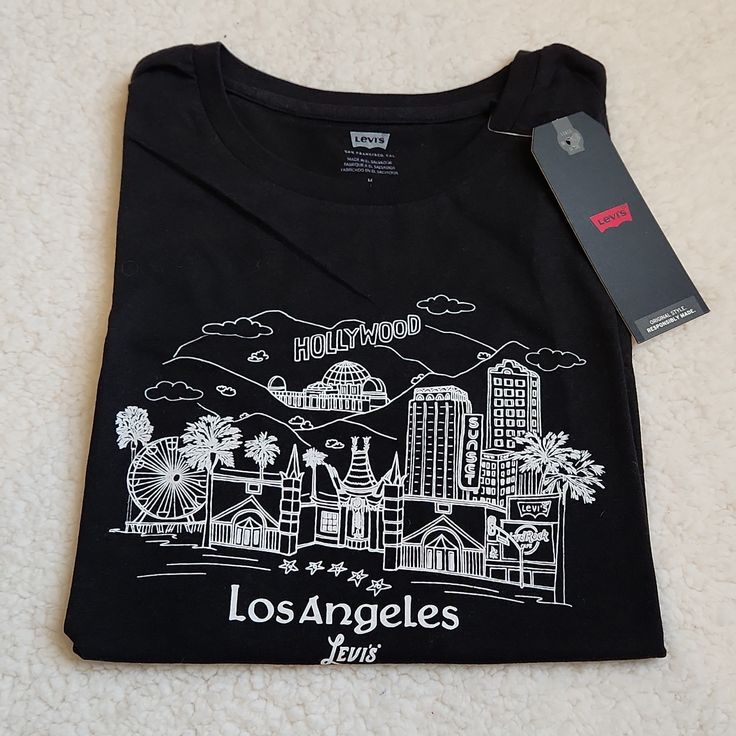 Nwt Levi’s Los Angeles Black Tshirt Size Medium Levi's Relaxed Fit Graphic T-shirt, Levi's Graphic Tee Crew Neck Top, Levi's Graphic Tee With Crew Neck, Levi's Cotton T-shirt With Graphic Print, Levi's Short Sleeve T-shirt With Text Print, Levi's Short Sleeve Letter Print Tops, Levi's Crew Neck T-shirt For Streetwear, Levi's Short Sleeve Tops With Letter Print, Black Relaxed Fit Top With Embroidered Graphics