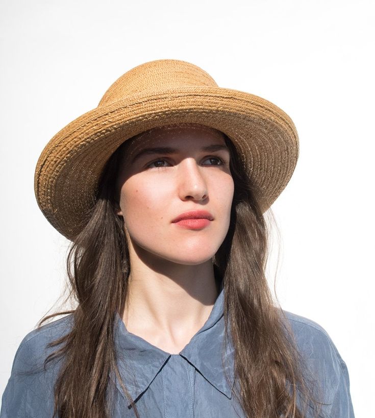 "Paz" is the ideal summer hat for you. A wide hat brim shields off too much sun, while the tall bowler shape sits perfectly even with a light sea breeze. The simple straw hat makes for a cool look on hot days. Made of antique Florentine straw, a rarity from the '60s, the summer hat is an ideal companion for trips to the summer resort. Lightweight and flexible, it offers the highest wearing comfort. Available in sizes 56 cm - 59 cm. Colour "wheat" Hat made of antique Florentine straw Grosgrain ri Elegant Handmade Hat Bands For Beach, Handmade Elegant Hat Bands For The Beach, Handmade Elegant Hat Bands For Beach, Elegant Handmade Panama Hat With Curved Brim, Elegant Straw Hat For Spring Picnic, Classic Mini Hat With Short Brim For Beach, Elegant Handmade Flat Brim Straw Hat, Elegant Handmade Panama Hat For The Beach, Elegant Handmade Panama Hat For Beach