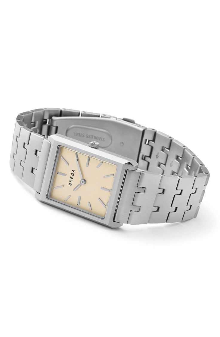 A rectangular case with angular edges complements the clean stick indexes of this vintage-inspired watch secured by brushed, interlocked bracelet links. 26mm case; 7mm case depth Adjustable bracelet; links can be removed at your local Nordstrom.  Deployant clasp closure Quartz movement Mineral crystal face Stainless steel or stainless steel with 18k-gold plate Imported Metal Watch, Vintage Timepiece, Square Watch, Minerals Crystals, Adjustable Bracelet, Silver Watch, Quartz Movement, Time Piece, Leather Watch