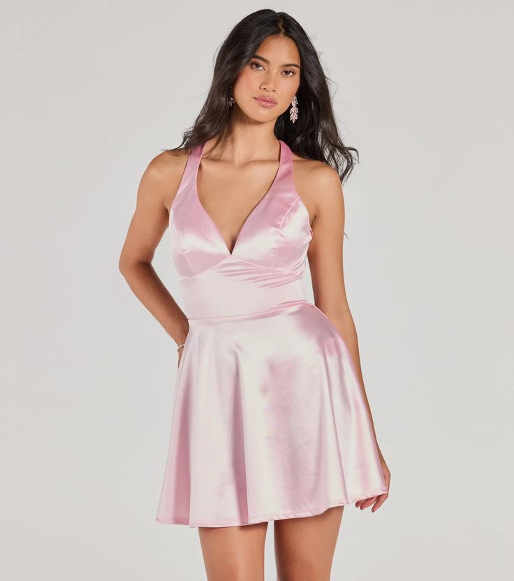 Bring glamour to the school dance in the Taylor satin party dress made to wow! The satin fabric adds a luxurious touch to your night. With a V-neckline, padded bra cups, shoulder straps, and a lace-up back, this dress highlights your figure in a skater silhouette and short-length hem. Compliment your look with a gorgeous hair accessory, bracelet, and heels!Fit & FeaturesSatin fabric, bust knit lining, minimal stretchV-necklinePadded bra cupsShoulder strapsLace-up back, lower zipper and hook- Flirty Sleeveless V-neck Dress For Party, Summer Party V-neck Dress With Fitted Bodice, Satin Finish V-neck Cocktail Dress, Satin V-neck Cocktail Dresses, Fitted Sleeveless Satin Dress For Prom Season, Fitted Sleeveless Satin Dress For Prom, Fitted V-neck Evening Dress For Prom, Elegant Pink Satin Halter Dress, Flirty V-neck Homecoming Dress