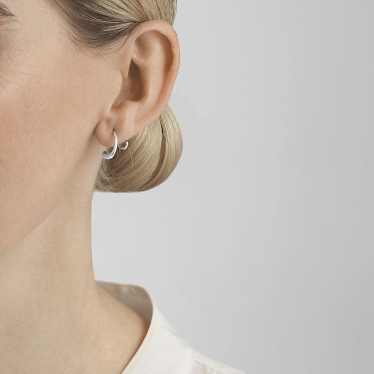 It is the unexpected twists and turns in life that truly define us, and the Mercy swirl earring is an emotional reminder of just that. The shape of the earring captures and symbolises the essence of time’s constant flow, and the way the earring seemingly hugs the earlobe makes us ever mindful from its touch on the skin. American designer Jacqueline Rabun strives to make her jewellery at one with the wearer. Her inspiration is often emotional, and she has a design language that features sculptura Elegant White Gold Spiral Earrings, Modern Spiral Earrings For Formal Occasions, Modern Sterling Silver Ear Cuff For Formal Occasions, Modern Twist White Gold Earrings For Anniversary, Modern Twist White Gold Hoop Earrings As Gift, White Gold Hoop Earrings With Modern Twist, Elegant Spiral Wrap Earrings, Modern White Gold Spiral Jewelry, Modern Twist Teardrop Earrings Gift