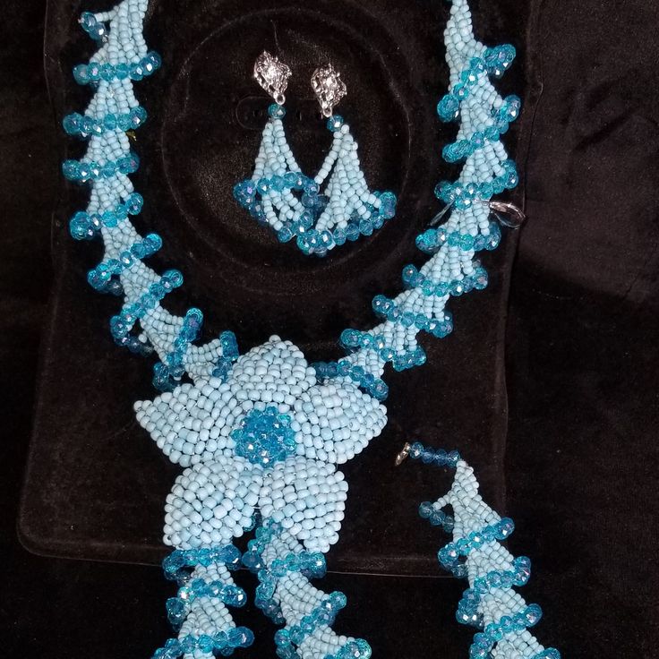 Hand Made African Traditional Necklace, Earing And Wrist Set Made With Beautiful, Unique, Long Lasting Beads. Blue Hand-strung Jewelry, Elegant Blue Faceted Beads, Blue Polished Beads Costume Jewelry, Elegant Handmade Light Blue Beaded Bracelets, Elegant Blue Beaded Bracelets With Faceted Beads, Elegant Blue Beaded Bracelet With Faceted Beads, Blue Crystal Round Beads, Elegant Blue Faceted Beads Bracelet, Elegant Blue Faceted Beaded Bracelets