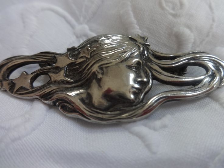 Lovely vintage brooch in the Art Nouveau style. I was told it is possibly silver although there are no silver markings. Would look great on a suit lapel,silk blouse or to pin a scarf. Measures 2 1/2 in.wide and 1 in. high. Clasp works well. Artistic Formal Brooch Jewelry, Silver Art Nouveau Brooches For Gifts, Silver Brooch Lapel Pin For Evening, Silver Lapel Pin Brooch For Evening, Silver Art Nouveau Brooches As Gift, Silver Art Nouveau Brooch, Silver Brooch Pins For Formal Occasions, Unique Formal Brooch Pin, Formal Silver Brooch Pin