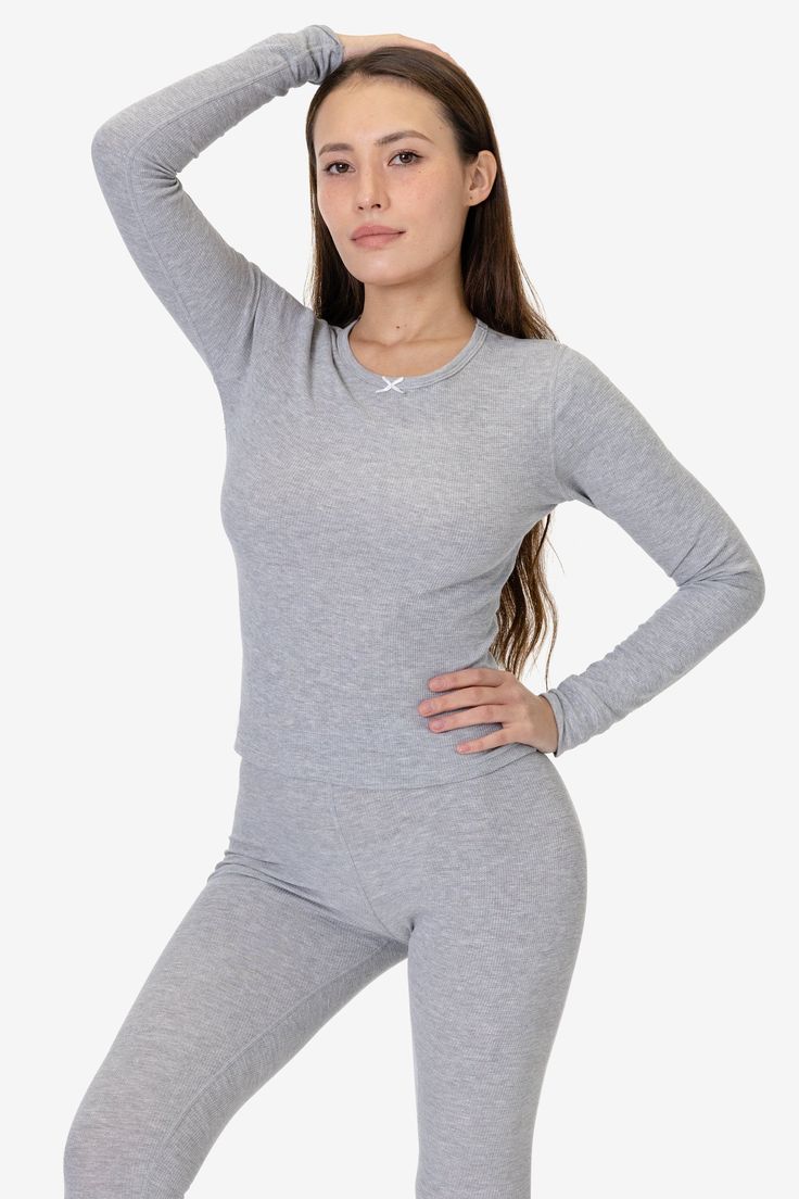 This thermal long sleeve top is an essential layering piece for the winter. Made of our 50/50 poly cotton waffle knit that keeps you comfortably warm and cozy. Features a delicate bow at the neckline, ribbed wrist cuffs and finished with durable flatlock seams. Try pairing with our matching T3280 Baby Thermal Leggings for a cute sleep or loungewear look. Runs true to size. Made in Los Angeles, Calif. Our experienced sewers earn up to $25 an hour and no less than $17.25; additionally workers have Cute Sleep, Thermal Leggings, Thermal Long Sleeve, Wrist Cuffs, Top For Women, Waffle Knit, Layering Pieces, 50 50, The Winter