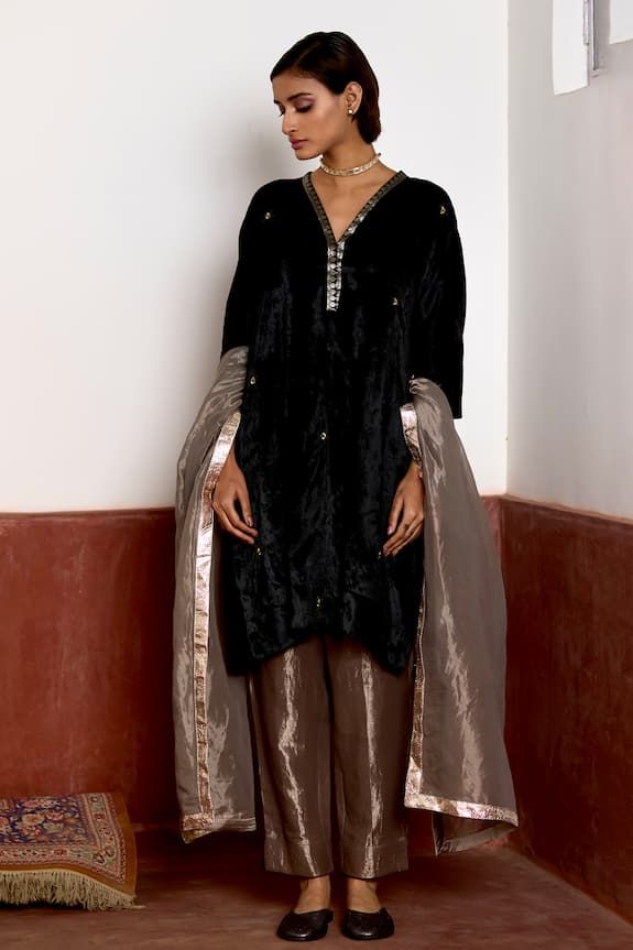 Black kaftan in velvet base with embroidery all over and heavy brocade neck placket. Comes with silver tissue cigarette pant. - Aza Fashions Traditional Velvet Sets With Sheer Dupatta, Velvet Sets With Sheer Dupatta For Eid, Velvet Party Sets For Eid, Designer Velvet Sets With Sheer Dupatta, Elegant Velvet Traditional Wear With Sheer Dupatta, Elegant Velvet Sharara With Dupatta, Velvet Sets With Sheer Dupatta For Designer Wear, Elegant Velvet Traditional Wear For Eid, Elegant Designer Velvet Salwar Kameez