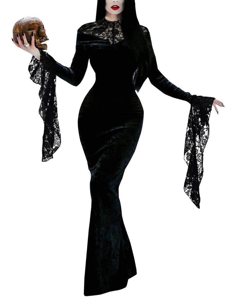 a woman dressed in black holding a donut and wearing a long sleeved dress