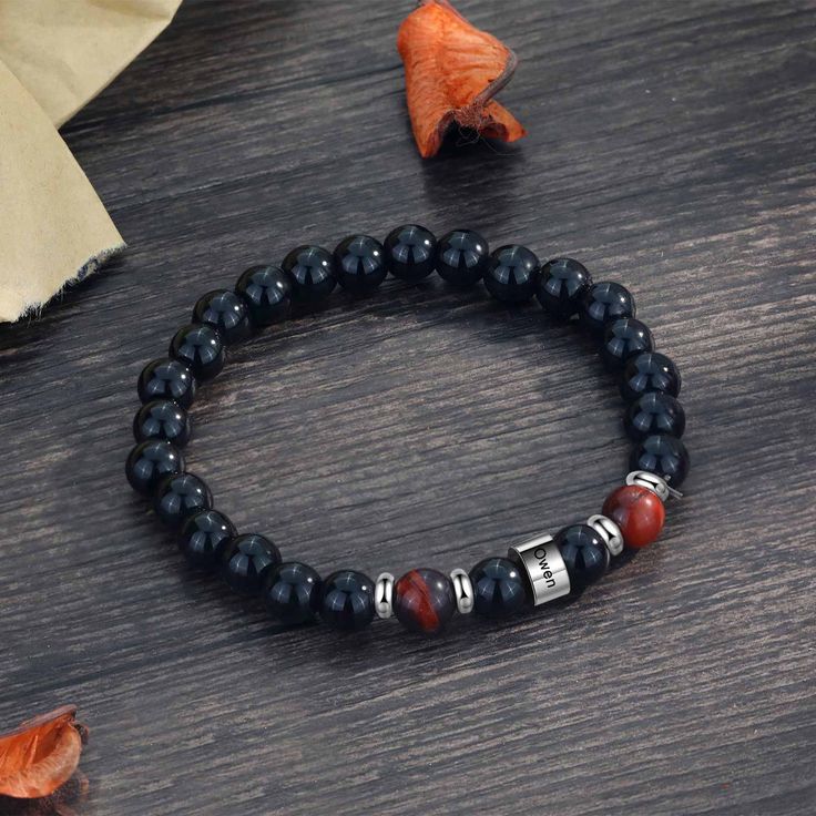 Looking for a personal gift that he'll remember forever, look to our unique selection of customizable bracelets for him. Our men's Black Agate bracelet with name engraved is detailed with three agate stones - healing crystals that symbolize harmony and rebalance, while promoting concentration and calmness.  The perfect jewelry gift idea for dads and granddads in Father's Day, this design comes detailed with a personalized silver-toned charm.This custom engraved bracelet will last forever and remind your dad every day of how much they are loved. ♥ On top of this custom black bracelet for men can be engraved.  S I Z E ∙ AND ∙ M A T E R I A L S ■ Bangle Circumference: 9″ / 22cm M A T E R I A L ■ This Black Bracelet for men made of high quality 316L surgical Stainless Steel & PU Leather ■ Desi Elegant Personalized Black Bracelets, Gift Stainless Steel Beaded Bracelets With Round Beads, Stainless Steel Beaded Bracelets As Gift, Stainless Steel Beaded Bracelets With Round Beads As Gift, Personalized Black Spiritual Jewelry, Personalized Black Bracelets As A Gift, Personalized Black Bracelets As Personalized Gift, Personalized Black Bracelets For Gift, Personalized Black Bracelet For Gift