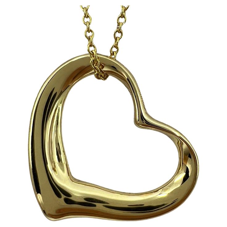 Vintage Tiffany & Co. Elsa Peretti Large Open Heart 18k Yellow Gold Pendant Necklace. A beautiful and rare authentic Tiffany & Co extra large open heart pendant from the stylish and popular Elsa Peretti range. Extra large size pendant. A rare variation of the Open Heart Elsa Perreti range, this heart extra large heart measures approx. 25x28mm and hangs on a 18' chain. The piece is signed Tiffany & Co. 750 (for 18k gold) and 'Elsa Peretti'. The chain is also stamped Tiffany & Co 750 and signed fo Elsa Perreti, Vintage Tiffany, Elsa Peretti, Large Heart, Necklace Box, Tiffany And Co, Black Necklace, Yellow Gold Pendants, Open Heart