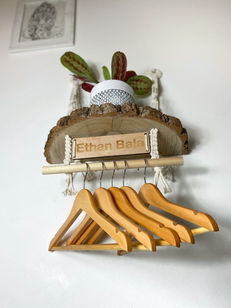 wooden clothes hangers are hanging on the wall