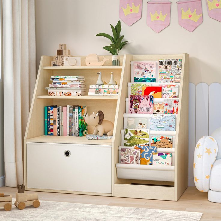 a child's book shelf with books and toys on it next to a white chair