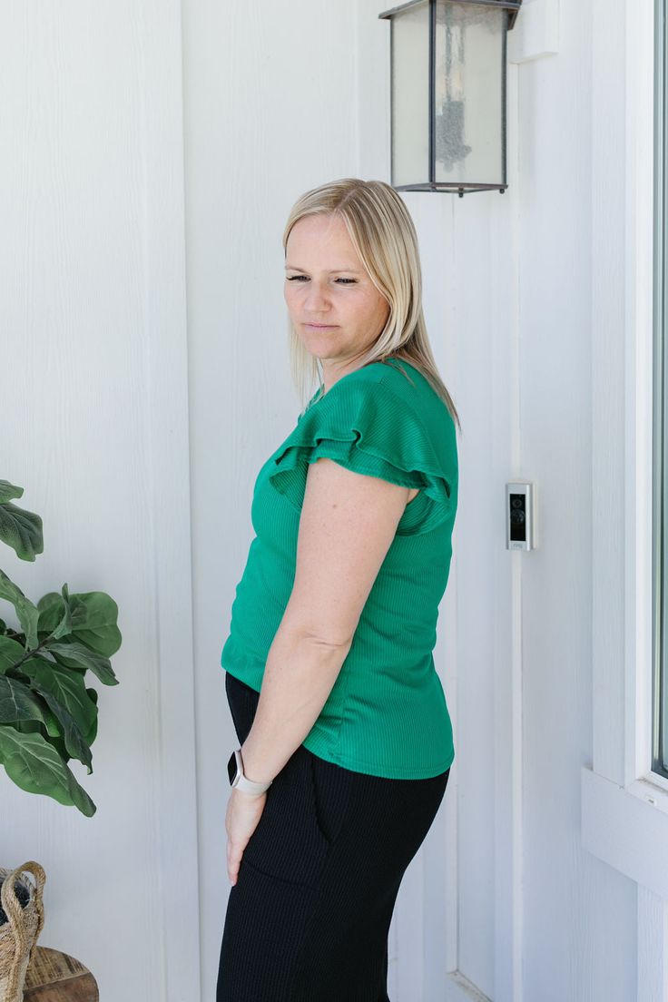 Experience the joy of wearing the Sophia Top! This emerald green solid shirt features ribbing for added texture, a round neck for comfort, and short flutter sleeves for a touch of playfulness. Perfect for everyday wear or dressing up for a night out. Model is wearing a large and is 5'5". Plus model is wearing a 1X and is 5'7". Size Chart Length Bust S 22.5" 32" M 23.5" 34" L 23.5" 36" 1x 26.5" 43" 2x 27" 46" 3x 27" 50" *All measurements are approximate and done while hanging.* Fabric and Care 92% Polyester 8% Spandex Hand wash cold separately, only non-chlorine bleach when needed, flat dry, warm iron if needed. Green Short Sleeve T-shirt For Work, Green Short Sleeve Top For Work, Green Short Sleeve Top For Everyday Spring Wear, Green Crew Neck Top For Day Out, Green Casual Flutter Sleeve Top, Green Stretch Top With Ruffles, Casual Green Top With Flutter Sleeves, Everyday Green Crew Neck Short Sleeve Top, Green Crew Neck Short Sleeve Top For Everyday