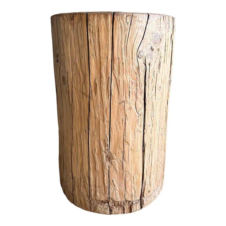 a close up of a wooden vase on a white background in the shape of a tree trunk