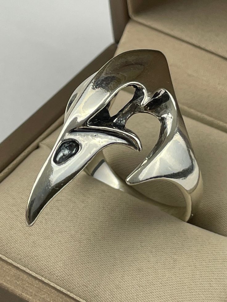 Elevate your style with our striking Silver Raven Skull Ring, a bold piece of gothic statement jewelry that captures the essence of mystery and intrigue. 💀 Key Features: 🌟 Handcrafted from high-quality silver, featuring a detailed raven skull design that commands attention 💎 Unique and eye-catching, this ring is perfect for those who embrace their dark side and love to make a statement 👑 Versatile design suitable for both men and women, making it a standout accessory for any occasion 🎁 Idea Silver Rings For Women Unique, Gothic Jewelry Rings, Raven Skull, Gothic Rings, Skull Ring, Skull Design, Jewelry Inspo, Dark Side, Rings Statement