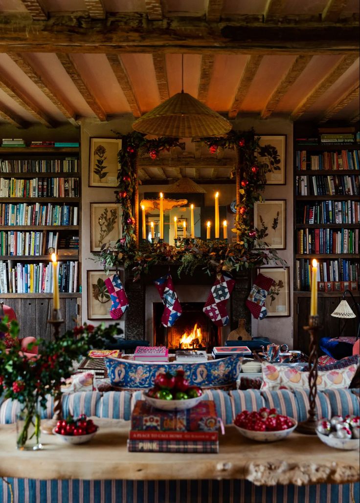 a living room filled with furniture and a fire place covered in books next to a fireplace