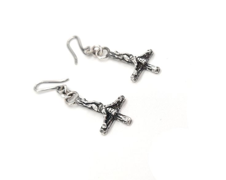 Miniature inverted crucifixes made in sterling silver. Please email to request a quote for 9ct or 18ct gold. Dimensions 13mm wide x 25mm long hanging on an 11mm handmade earring hook Pierced Crucifix Jewelry Gift, Sterling Silver Cross Jewelry With Matching Earrings, Sterling Silver Cross Pendant Earrings For Gift, Nickel-free Cross-shaped Sterling Silver Earrings, Nickel-free Sterling Silver Cross Pendant Earrings, Nickel-free Cross Pendant Earrings In Sterling Silver, Nickel-free Sterling Silver Cross Earrings, Nickel Free Sterling Silver Cross Earrings, Sterling Silver Cross Earrings With Ear Wire