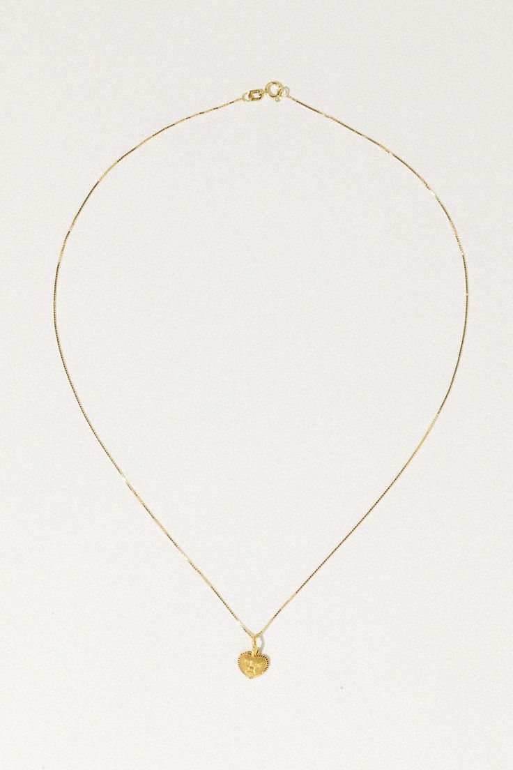 High-quality 14K gold lover's heirloom necklace. Featuring a small heart pendant with a Cupid in it's center, adorned on a glistening box chain. In Roman mythology, Cupid is known as the god of love and affection. He is known to shoot magical gold-tipped arrows at both gods and humans. Piercing their heart with his arrow, causing those he strikes to fall deeply in love. ✦ Chain measures 16 inches / 14k Solid Gold ✦ Pendant measures 8x7mm / 14k Solid Gold Dainty Gold Heart Necklace, Heirloom Necklace, Small Heart Pendant, God Of Love, Roman Mythology, Heart Pendant Gold, Gold Heart Necklace, Love Deeply, Small Heart