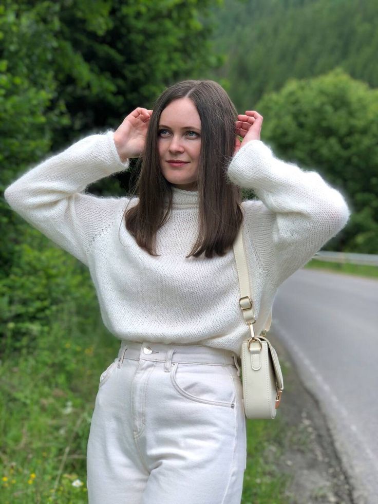 Stay cozy and stylish in this luxurious white angora wool sweater with a chic high collar. Handcrafted with the finest quality angora wool, this sweater is soft, warm, and perfect for chilly days. The timeless design and classic color make it a versatile piece for any wardrobe. white turtleneck look at the photo of flowers and choose which one you like. The color plate is shown in the photo The sweater in the photo is made in color No.11 🤍Materials:   Made with premium white angora wool  80% an Chic Cream Turtleneck For Fall, Trendy White Turtleneck Sweater, Chic White Long Sleeve Turtleneck, White Chunky Knit Turtleneck For Winter, Winter White High Neck Sweater, Chic White Turtleneck For Fall, Trendy White High Neck Sweater, Cozy Cream Chunky Knit Turtleneck, Cozy Oversized White Turtleneck