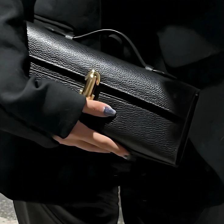 ✨ Elevate your evening look with our Elegant Leather Clutch Bag, the epitome of sophistication and style. Crafted from premium genuine leather, this luxurious small tote combines timeless design with a touch of modern minimalism. Its sleek silhouette is perfect for any night out, adding an effortlessly chic vibe to your ensemble. 💼 Bag Size: 27cm Length x 11cm Height x 7cm Width (10.6" x 4.3" x 2.8") 🌟 Key Features: Material: Genuine Leather 🧵 Top Handle Design: Easy to carry, perfect for both casual and formal occasions. Versatile Styles: Available in Olive Green, Black, and White to match any outfit. Secure Closure: Ensures your essentials are safe while looking stunning. Whether you're heading to a special event or simply stepping out for the evening, this stylish leather handbag wil High-end Clutch For Daily Use As Shoulder Bag, High-end Shoulder Bag Clutch, High-end Formal Pouch Bag, High-end Evening Mobile Phone Bag, High-end Mobile Phone Bag For Evening, Modern Handheld Box Bag For Business, High-end Evening Bag With Removable Pouch, High-end Business Pouch Shoulder Bag, Office Clutch Baguette Bag With Removable Pouch