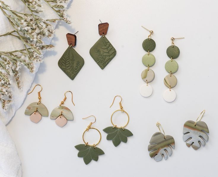 Each earring is meticulously crafted, capturing the intricate details of nature, giving them a sense of unique beauty. Each earring has a peaceful sage color that gives a calming earthy feel. Very lightweight with lots of movement!  Drop length ranges from 1 3/4" to 2 1/4"  Each pair is a one-of-a-kind, handmade with love which may include variations and imperfections.  Please check out our shop for more styles.  Follow us on instagram at @fernie.and.co Everyday Leaf-shaped Jewelry With Matching Earrings, Minimalist Leaf-shaped Jewelry With Matching Earrings, Minimalist Dangle Plug Earrings As Gift, Earthy Dangle Earrings With Ear Wire, Minimalist Leaf-shaped Ear Wire Jewelry, Single Earring Nature-inspired Jewelry As Gift, Nature-inspired Single Earring As A Gift, Handmade Leaf-shaped Nature-inspired Earrings, Nature-inspired Single Earring As Gift