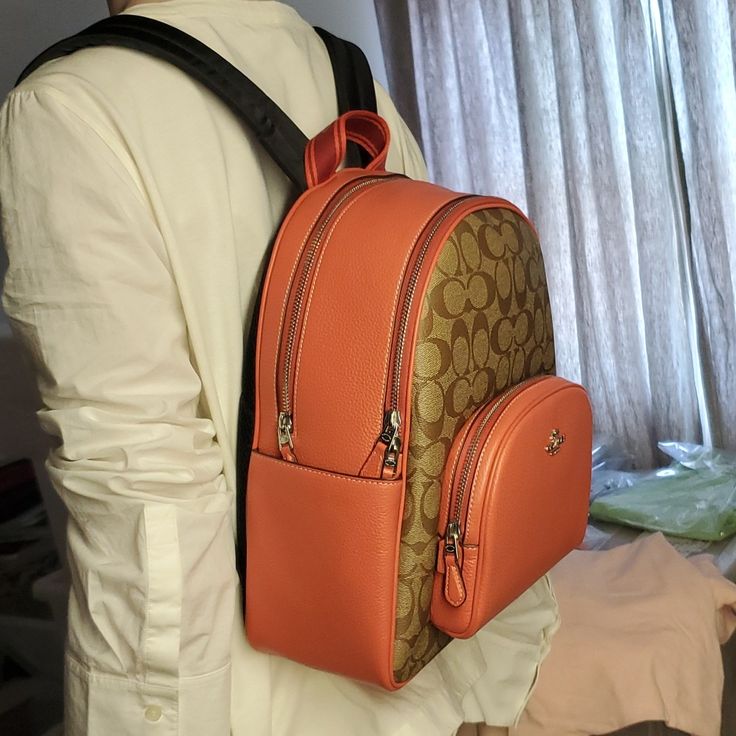 100% Authentic Or Money Back Guarantee !!! Coach Cj593 Court Backpack In Signature Canvas Silver/Khaki/Tangerine (Last One) Signature Coated Canvas And Refined Pebble Leather Inside Zip And Multifunction Pockets Double Zip Closure, Fabric Lining Handle With 2 1/4" Drop Outside Zip Pocket Adjustable Shoulder Straps 10 3/4" (L) X 12 1/2" (H) X 4 3/4" (W) Style No. Cj593 Luxury Coated Canvas Backpack With Large Capacity, Luxury Large Capacity Coated Canvas Backpack, Coated Canvas Backpack With Large Capacity, Large Capacity Coated Canvas Backpack, Orange Backpack With Adjustable Strap For Everyday Use, Orange Everyday Backpack With Adjustable Strap, Coach Orange Leather Bag, Orange Leather Coach Bag, Orange Backpack With Adjustable Strap