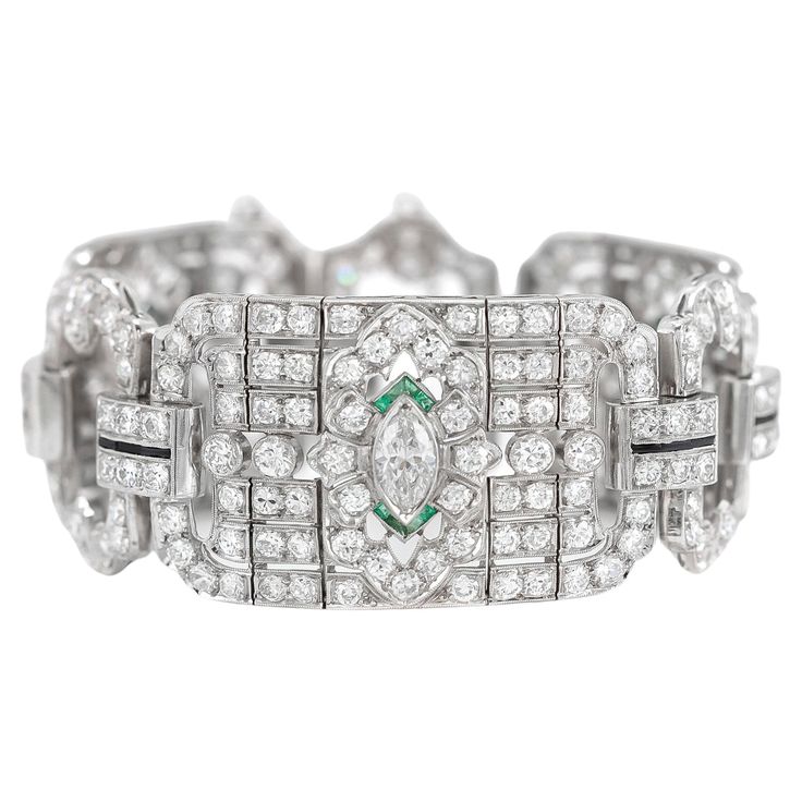 Finely crafted in platinum with 3 Marquise cut Diamonds weighing approximately a total of 2.00 carats, and Old European cut diamonds weighing approximately a total of 20.00 carats. The bracelet features Emerald and Onyx accents. Art Deco, circa 1930s 6 3/4" x 1 1/8" Marquise Cut Diamond, European Cut Diamonds, Marquise Cut, Dream Jewelry, Diamond Bracelet, Onyx, Diamond Cuts, Platinum, Emerald