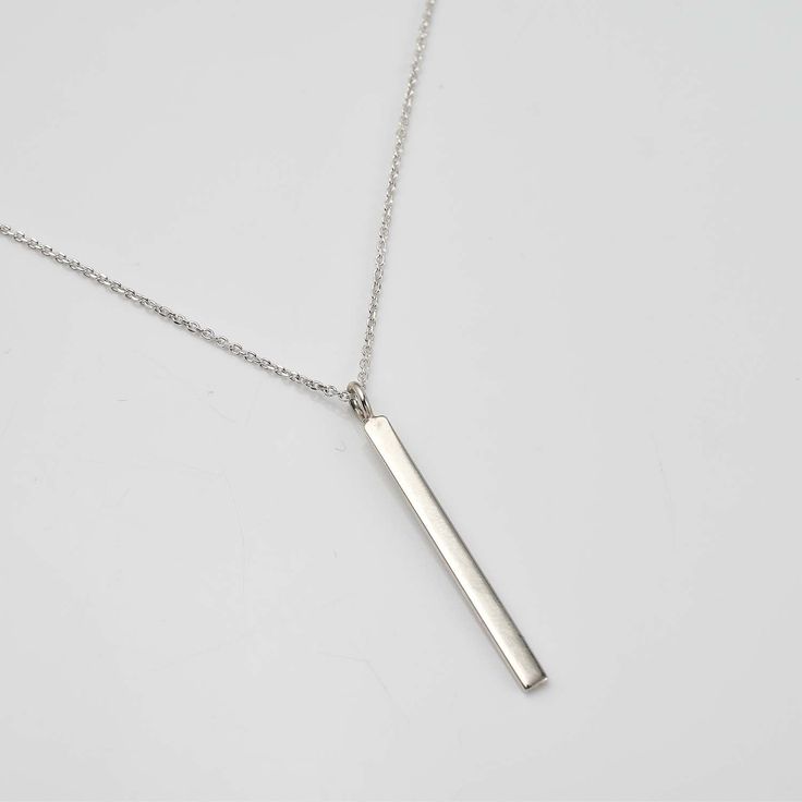 Personalize your style with the Engravable Silver Bar Necklace ✨💖! This elegant accessory features a sleek silver bar that can be customized with your special message or date. 💫 Perfect for any occasion, its minimalist design complements any outfit with modern flair. Crafted with high-quality materials for durability, the adjustable chain ensures a comfortable fit. 💕 Treat yourself or a loved one to this timeless accessory that will be cherished for years to come! 💖 Elegant Silver Rectangular Bar Necklace, Modern Sterling Silver Bar Necklace, Classic Silver Bar Necklace, Classic Silver Bar Necklace As A Gift, Classic Sterling Silver Bar Necklace, Modern Sterling Silver Bar Necklace As Gift, Modern Sterling Silver Bar Necklace For Gift, Simple Silver Necklace With Rectangular Pendant, Minimalist Silver Engraved Bar Necklace