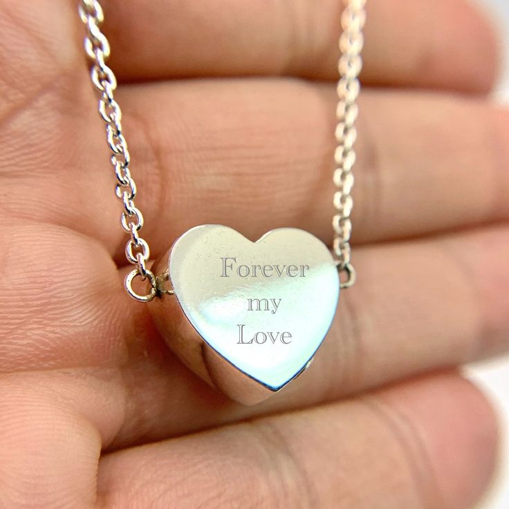 This is the perfect gift and a unique way to carry your loved ones close to your heart. You can access the compartment in the pendant through a small screw on the bottom. ❤️Material:925 sterling silver; ❤️Free Engraving available: the back can be personalized with engraving message. 10 characters max. ❤️Included in the package:18" matching chain,gift box, filling funnel kit; ❤️ Care Instructions Though the materials used is made of sterling silver, I recommend you to not sleep, swim, or spray chemicals (i.e. perfumes, lotions, or body spray) on to the necklace to preserve its longevity. Please follow these tips to preserve the longevity of the necklace. To clean, it is best to use a soft microfiber cloth to clean the jewelry from smudges. Engraved Stainless Steel Jewelry For Valentine's Day, Silver Stainless Steel Heart Necklace, Personalized Silver Heart Necklace With Engraving Option, Personalized Silver Heart Necklace In Stainless Steel, Silver Heart Necklace With Engraving Option For Personalized Gift, Silver Heart Necklace With Engraving Option, Engraved Open Heart Keepsake Necklace, Engraved Stainless Steel Heart Pendant Jewelry, Mother's Day Engraved Stainless Steel Heart Necklace