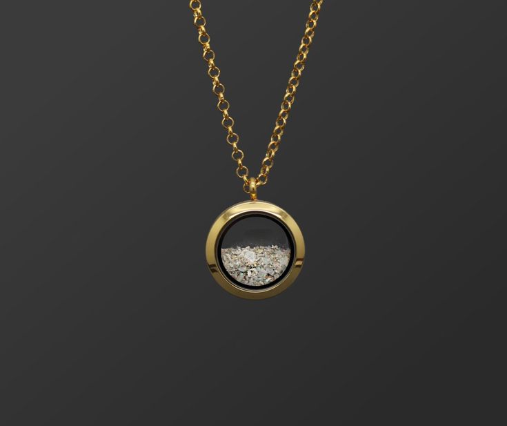 "This unisex customizable cremation ash locket is new to our collection of fill-at-home cremation pieces. Your purchase includes the gold toned locket, gold toned chain, and opal color of your choice and does not require mailing the ashes. It is composed of sturdy glass and gold-toned stainless steel (hypoallergenic, scratch/tarnish resistant). The chain is 32\". If screwed properly, the locket is air and watertight. The round pendant measures 25mm across and is the perfect size for a classy and Ash Pendant Cremation Jewelry, Necklace For Ashes, Ashes Necklace Cremation Jewelry, Diy Urns For Ashes, Gold Cremation Necklace, Urn Necklaces For Ashes, Thumbprint Jewelry, Jewelry For Ashes, Cremation Urn Jewelry